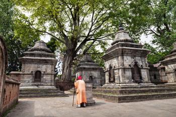 Monk and towers of Pashupatinath temple, Khatmandu, Nepal