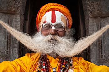 KATHMANDU - APRIL 15: Sadhu at Pashupatinath Temple in Kathmandu, Nepal on April 15, 2012. Sadhus are holy men who have chosen to live an ascetic life and focus on the spiritual practice of Hinduism