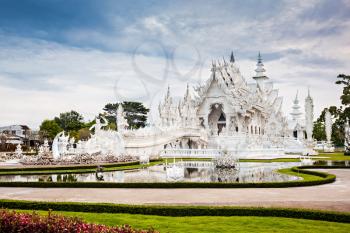 Wat Rong Khun (White Temple) is a contemporary art exhibit in the style of a Buddhist temple in Chiang Rai, Thailand 