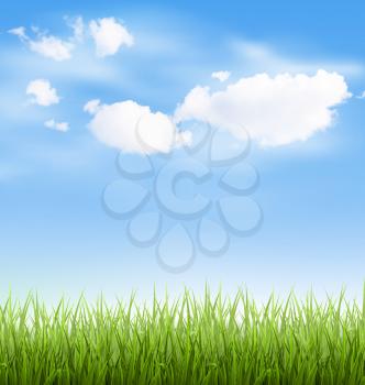 Green grass lawn with clouds on blue sky