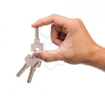Mens hand holding keys isolated on white