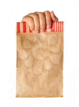 Hand holding or giving a brown paper bag