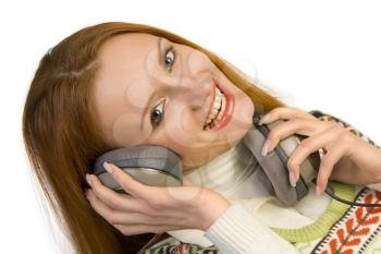 Beautiful attractive smiling woman with headphones isolated on white