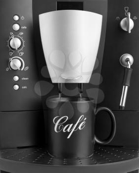 Front view of coffee machine with black cup