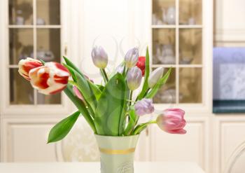 Tulip flowers in a vase in the kitchen