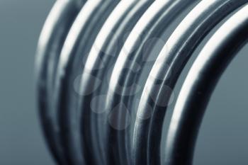 Close-up picture of aluminum spirals isolated on gray background
