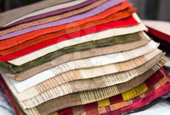 Multicolored samples of various fabrics closeup