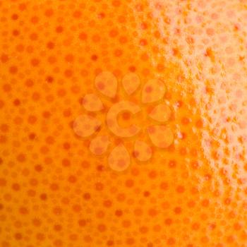 Orange skin. Close-up photo. Fresh fruit. Doted background.