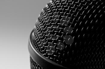 Close-up view of a modern black microphone