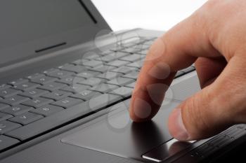 Hand working on a computer touchpad