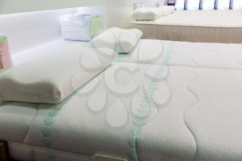 Comfortable soft white bed with pillows