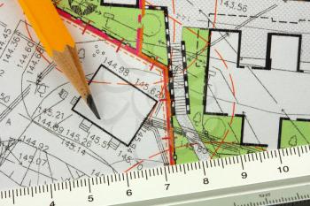 Pencil and ruler on architectural general plan