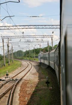 Passenger train and rail road. Perspective