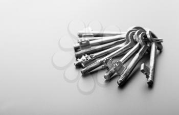 Bunch of keys isolated on grey background