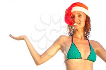Tan woman in christmas hat inviting to sea. Isolated on white