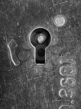 Close-up view of old scratched lock keyhole