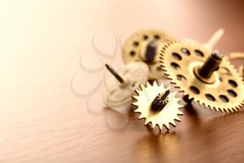 Different gears on the wooden table