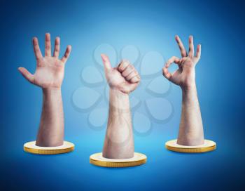 Three hands in the coins showing gestures over blue