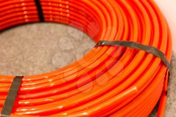 Closeup view of red plastic pipe
