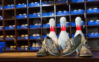 Bowling shoes and pins close up