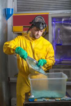 Man in protective suit cooking meth in the lab