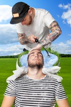 Young man having his hair washed in barber's shop over nature background