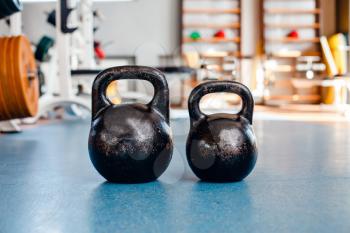Kettle bells on the floor in the gym