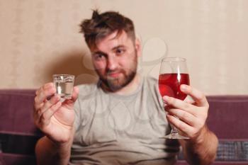 Alcohol addicted man after hard drinking. Alcohol abuse problem concept.