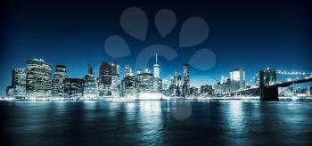 Illuminated Manhattan view from hudson at night time, New York City USA