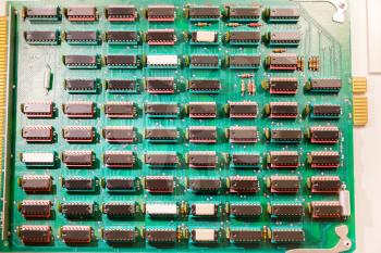 Many chips mounted on electronic plate. Analog microprocessor