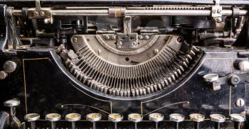 Retro grunge black typewriter closeup. Antique type writer
