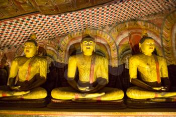 Ceylon, golden statues in buddha  temple. Shri Lanka, Unesco heritage. Asia culture, bubbhism religion
