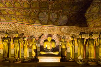 Ancient golden statues in buddha temple on Ceylon. Sri Lanka, Unesco heritage. Asia culture, bubbhism religion