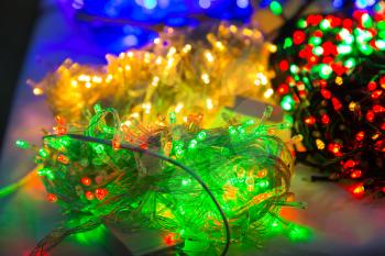Merry christmas decoration closeup, lights, garland, xmas decor, new year. Winter holiday celebration
