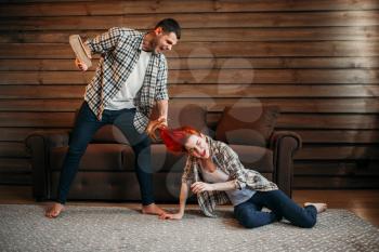 Family quarrel, domestic violence, agressive husband beats wife. Problem relationship