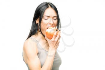 Cold, snot and flu protection, woman eats onion, white background. Female person in lingerie, disease prevention