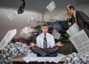 Businessman meditates among crumpled paper trash and a piles of reports, bureaucracy and paperwork, office routine in business, deadline concept