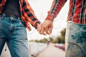 Love couple of tourists holding hands, happy vacation. Summer adventure of young man and woman