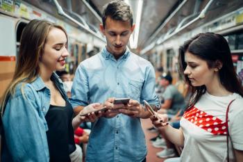 Addict youth using phones in metro, addiction problem, social addicted people, modern underground lifestyle