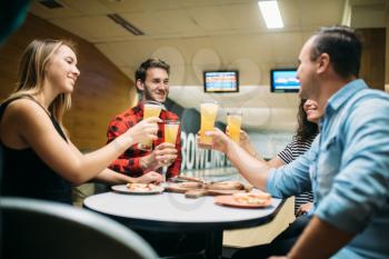 Bowling team celebrate the victory in the competition. Friends relax after playing tenpin game in club, active leisure, healthy lifestyle