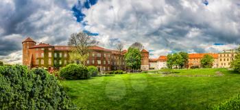 Grass lawn in Wawel castle, panoramic view, Krakow, Poland. European town with ancient architecture buildings, famous place for travel and tourism