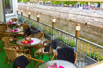 Outdoor cafe on the river, Karlovy Vary, Czech Republic, Europe. Old european town, famous place for travel and tourism