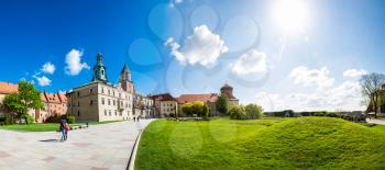 Wawel castle yard with lawn, panoramic view, Krakow, Poland. European town with ancient architecture buildings, famous place for travel and tourism