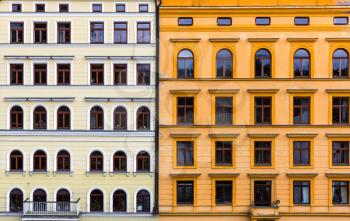 Two combined building facades, old European town. Summer tourism and travels, famous europe landmark, popular places and streets
