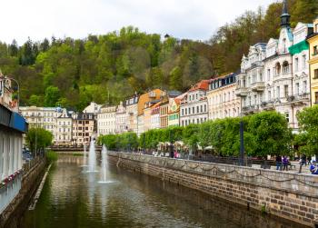 City river and stone pedestrian bridge, Karlovy Vary, Czech Republic, Europe. Old european town, famous place for travel