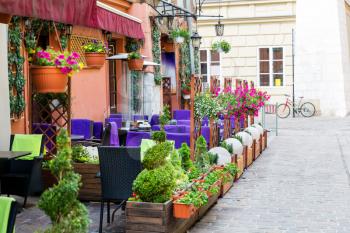 Street cafe in ancient European tourist town. Summer tourism and travels, famous europe landmark, popular places for travelling