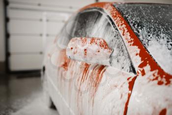 Vehicle in foam, car wash service, nobody. Automobile on carwash station, car-wash business concept