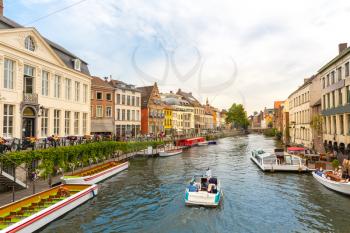 Walking boats on river canal in old tourist town, Europe. Ancient european city, famous place for travel and tourism, traditional architecture