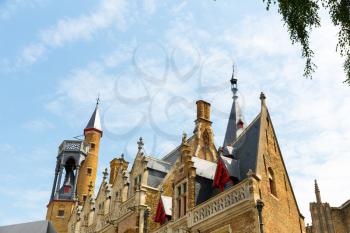 Ancient building with towers, provincial European town. Summer tourism and travels, famous europe landmark, popular places for travelling