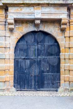 Grunge wooden door, ancient european tourist city. Summer tourism and travels, famous europe landmark, popular places for travelling